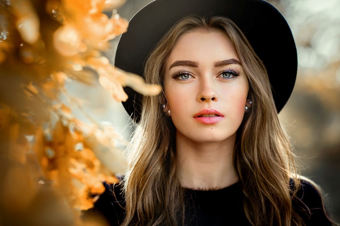 face, black hat, looking at viewer, pearl earrings, women, hat, millinery, pink lipstick, open mouth, blue eyes, women outdoors, depth of field, long hair, blonde, black sweater, portrait, Olga Boyko, model