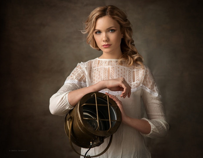 Woman holding a vintage spotlight