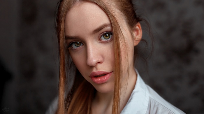 Portrait of a young woman with red hair