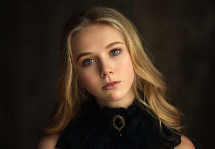 Portrait of a young blonde woman with blue eyes