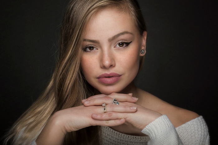 Portrait of a young blonde woman with makeup