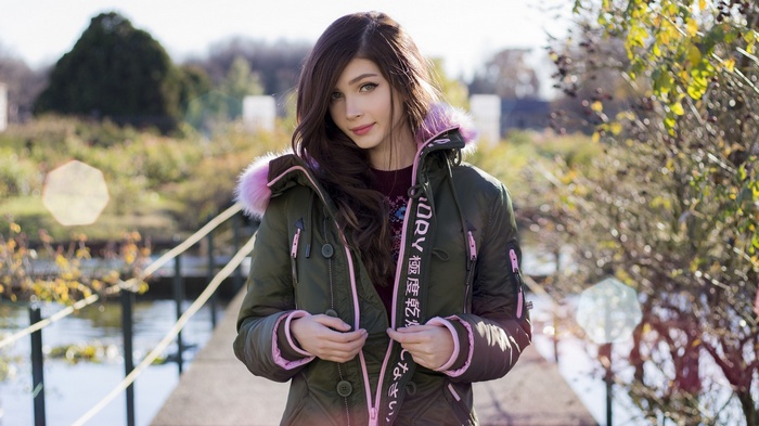 Karina Kozyreva in a green jacket with pink fur trim