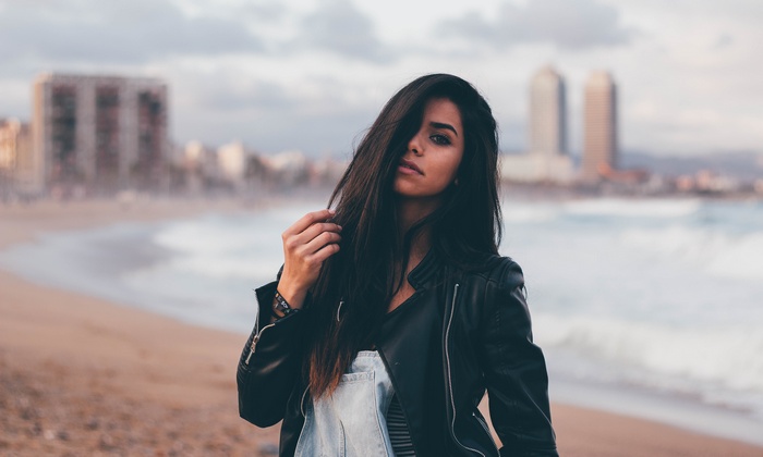 Woman with black hair on a beach