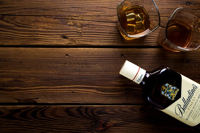 Ballantine's Finest Scotch Whisky bottle and glasses