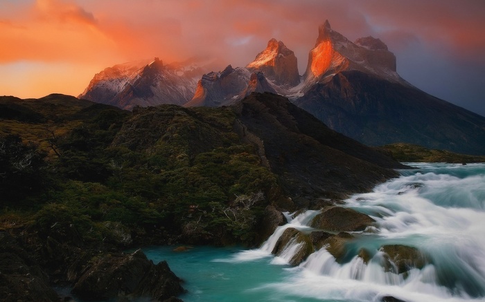 Torres del Paine mountains at sunset with river