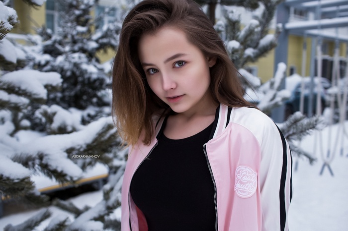 Woman in pink jacket in snow