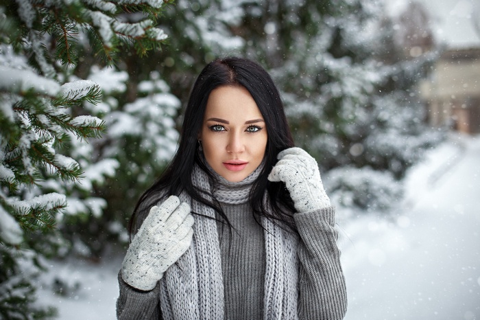 Angelina Petrova portrait in snow with fir trees