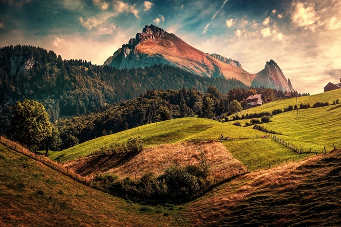Switzerland landscape with mountains and green hills