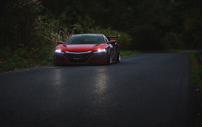 Red Honda NSX with LB Works body kit on a road