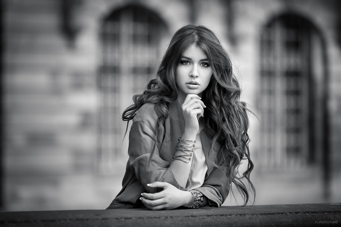 Monochrome portrait of a woman with long wavy hair