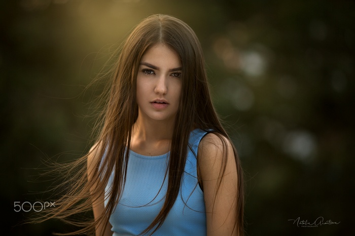 Portrait of a young woman with long hair