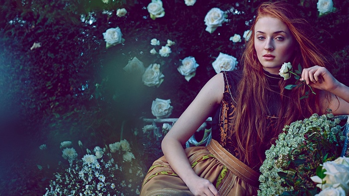 Sophie Turner with roses in a garden