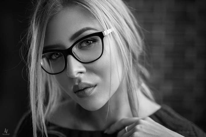 Monochrome portrait of a woman wearing glasses