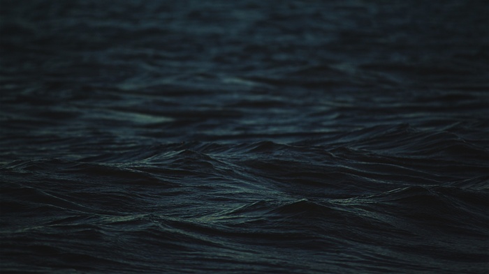 Dark blue ocean waves with shallow depth of field