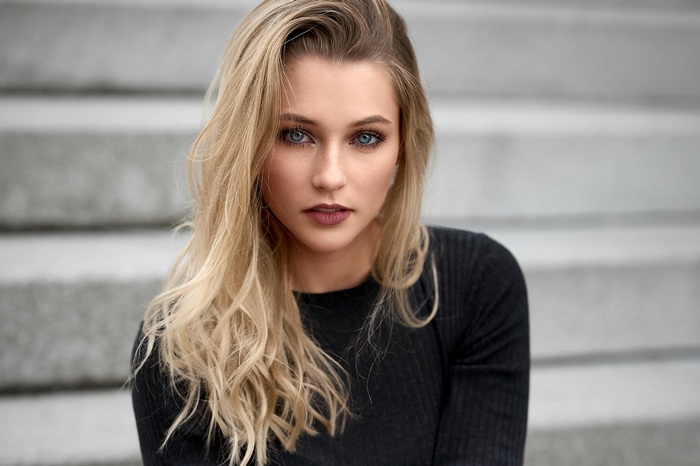 Woman with blonde hair and blue eyes