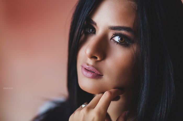 Woman with black hair and brown eyes, close-up portrait