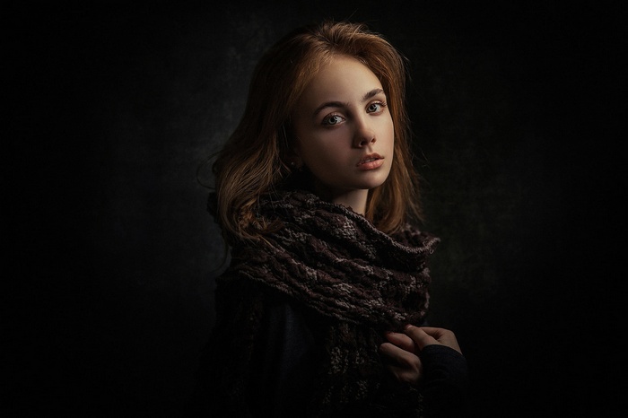 Portrait of a young woman with a scarf