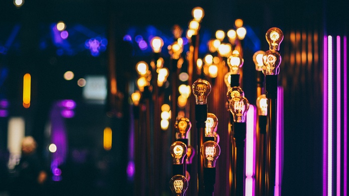 Close-up of illuminated lightbulbs with bokeh background
