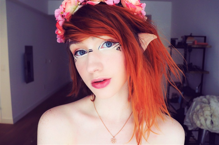 Redhead woman with elf ears and flower crown