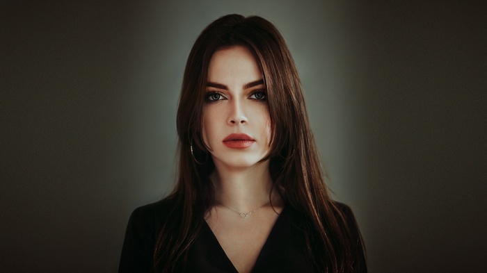 Woman with red lipstick and necklace