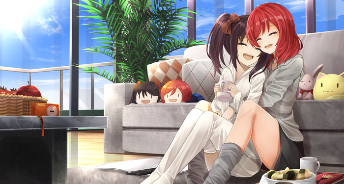 Maki Nishikino and Nico Yazawa from Love Live! hugging on a couch