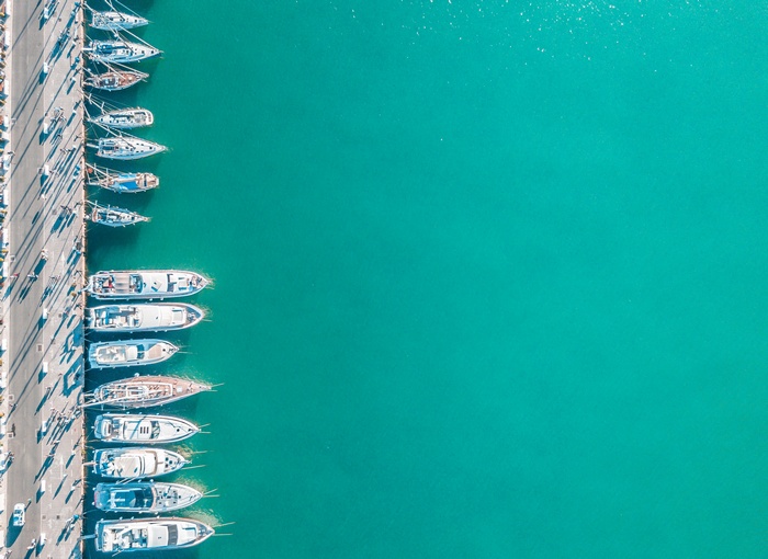 Boats docked in a turquoise harbor
