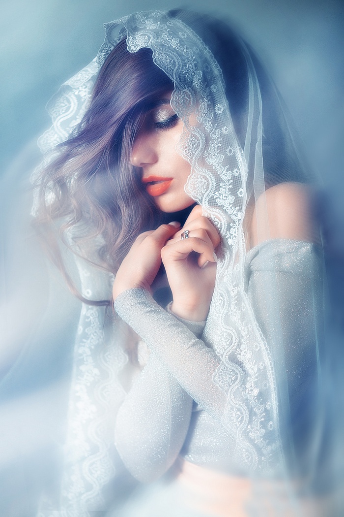 Woman with veil and makeup