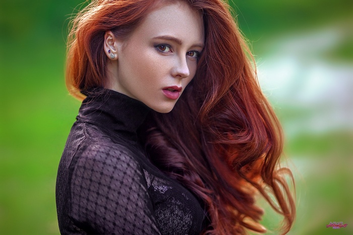 Redhead woman with long wavy hair, Alexandra Girskaya