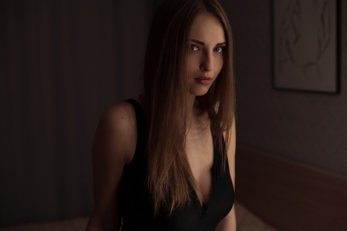 Woman with long brown hair wearing black clothing