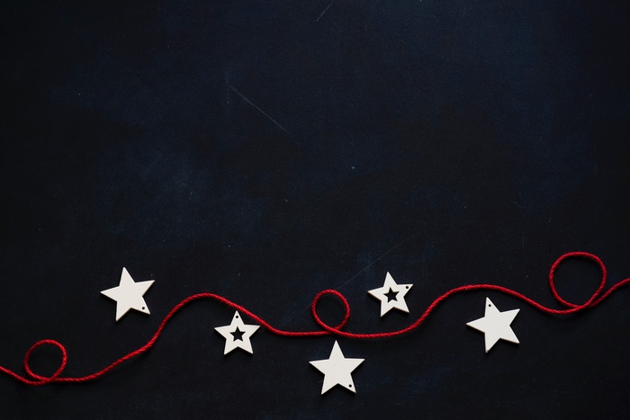 Minimalist Christmas ornaments on a dark background