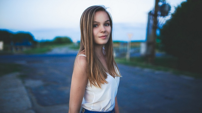 Woman with nose ring and white top