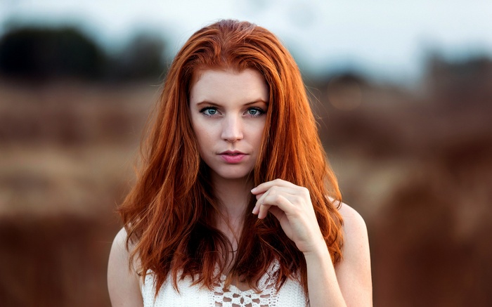 Portrait of a Redhead Woman with Blue Eyes