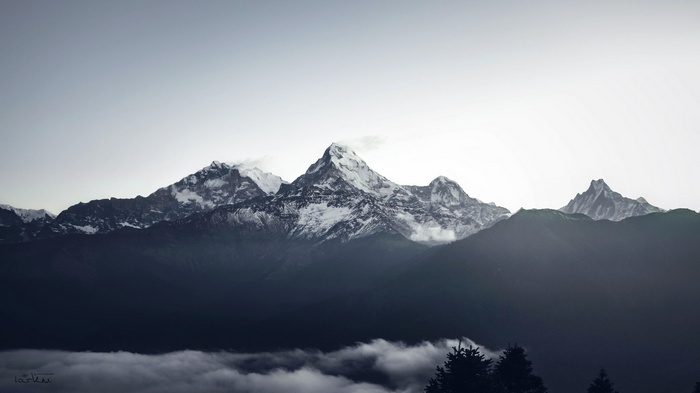 Snow-capped Himalayas mountains above clouds