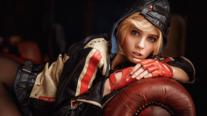 Woman in leather jacket and hat