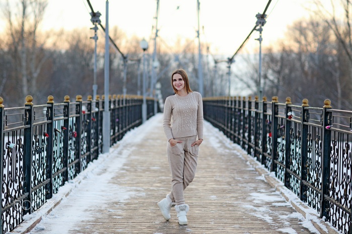 Woman on a snowy bridge