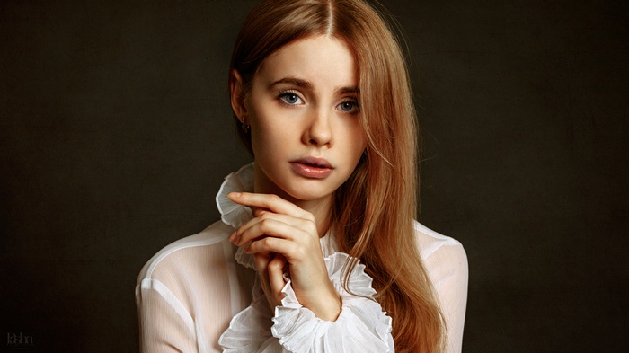 Portrait of a young woman with blonde hair