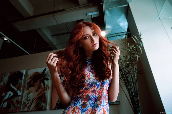Redhead woman in a colorful dress