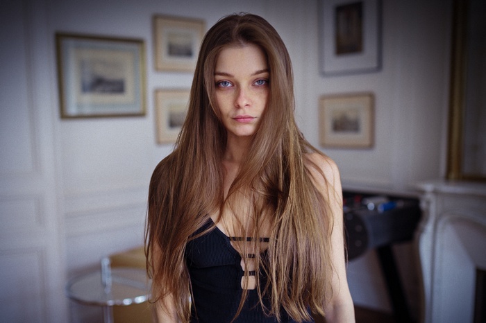 Woman with long brown hair and blue eyes