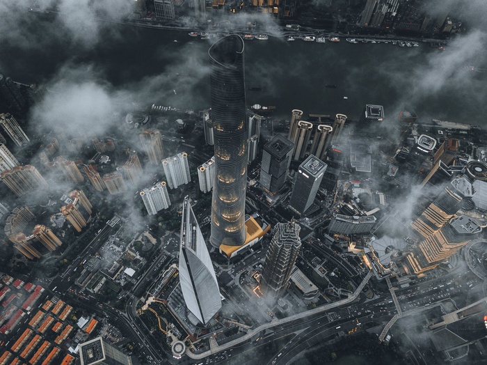 Aerial view of Shanghai skyscrapers shrouded in clouds