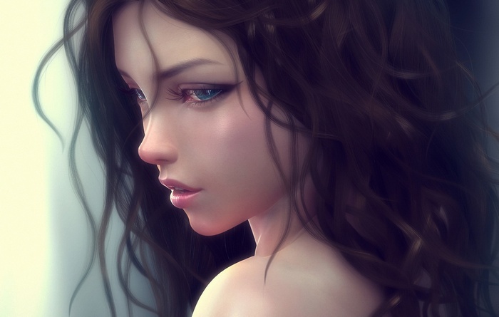 Close-up of a woman with curly brown hair and blue eyes
