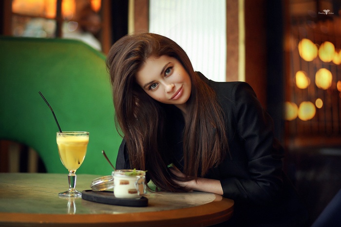 Alina with long brown hair wearing a black jacket