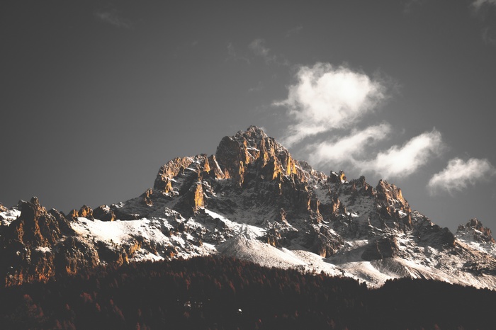 Snow-covered mountains with clouds