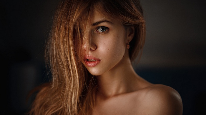 Portrait of a young woman with hair covering her face