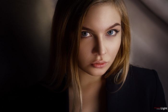 Portrait of a blonde woman with blue eyes by Alexander Drobkov