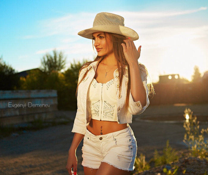 Woman in white outfit and hat by Evgenyi Demenev