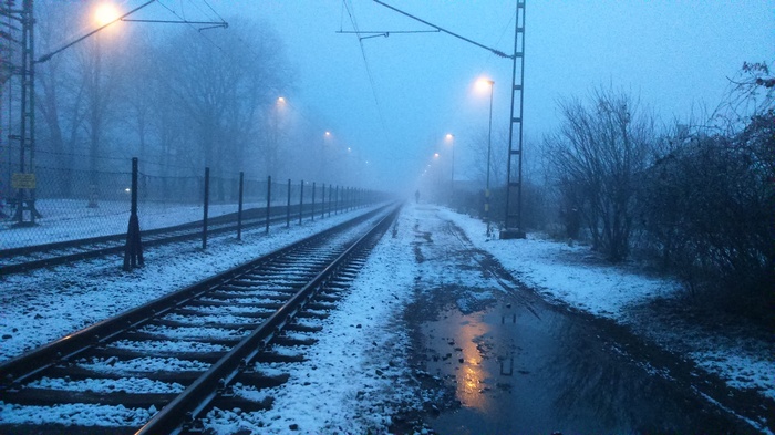 Snowy railway station in mist, Tiszaluc, Hungary