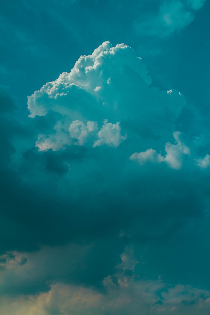 Dramatic clouds in a teal sky
