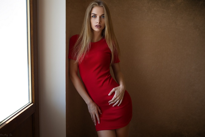 Model Karina Tikhonovskaya in red minidress