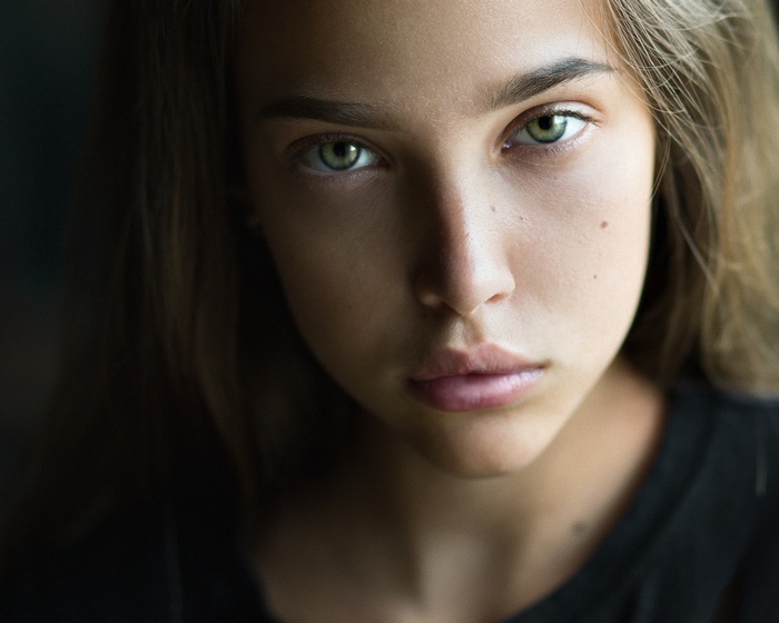 Portrait of a young woman with green eyes