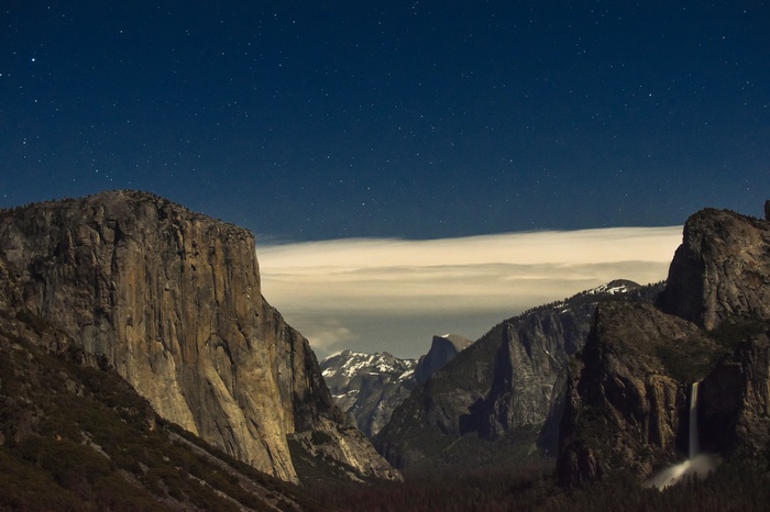 Yosemite Valley at Night with Stars and Clouds